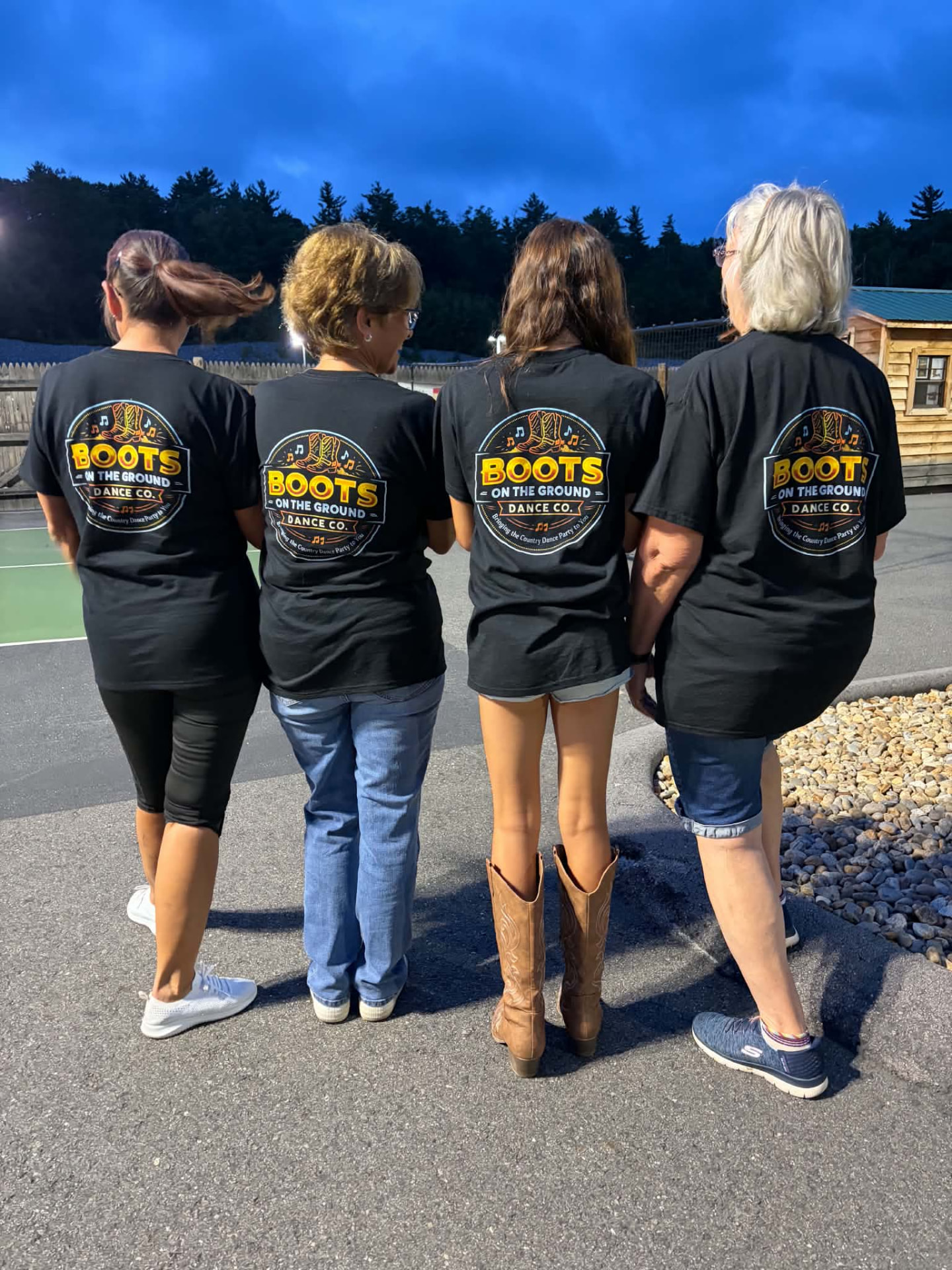 Boots on the Ground dancers together in community shirts